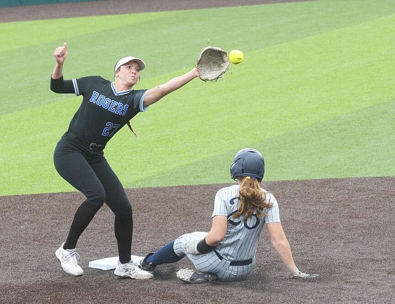 Eva Riffe (28) is safe at second for Bentonville West on a play defended Tuesday by Dahana Tuomala for Rogers.
(NWA Democrat-Gazette/Flip Putthoff)
