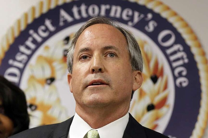 FILE - Texas Attorney General Ken Paxton speaks at a news conference in Dallas on June 22, 2017. (AP Photo/Tony Gutierrez, File)
