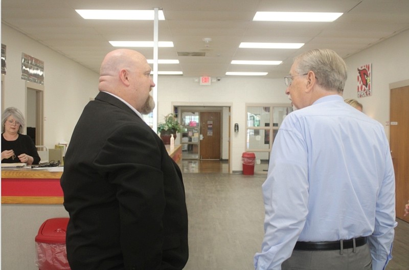 Photo by Bradly Gill
Mack Skelton, left, meets with Ed Winters, left, during a community Meet and Greet. Skelton was hired as the new Camden Fairview High School principal at last week's school board meeting.