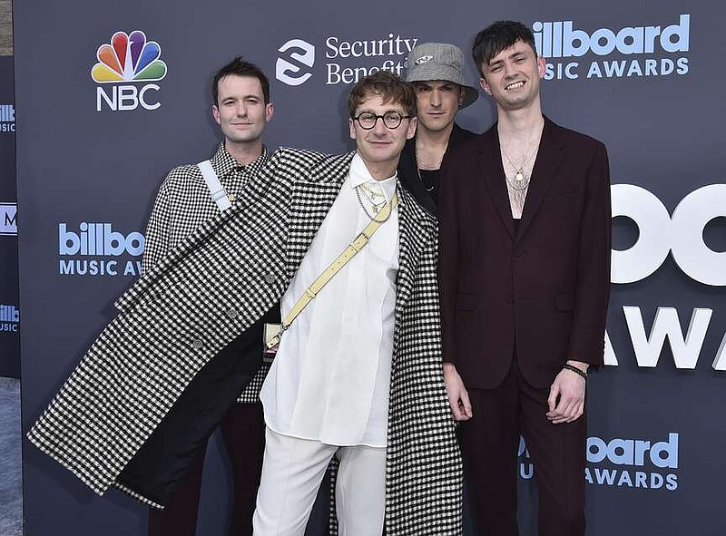 Glass Animals will perform Sept. 1 in Rogers. In this AP file photo, band members Drew MacFarlane, (from left) Dave Bayley, Joe Seaward and Edmund Irwin-Singer arrive at the Billboard Music Awards in 2022 at the MGM Grand Garden Arena in Las Vegas. The English indie-pop band releases its fourth album on July 19. 
(AP file photo/ Jordan Strauss/Invision)