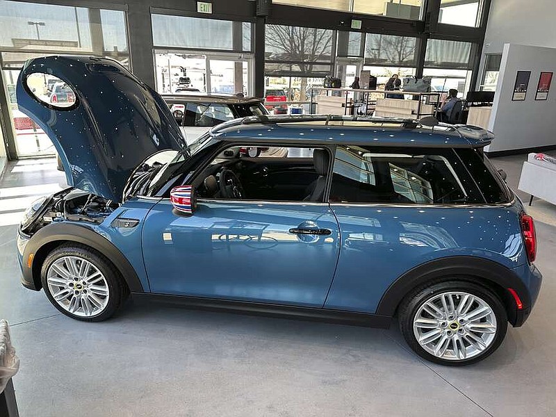 An unsold 2024 Cooper SE electric hardtop sits on the showroom floor of a Mini dealership Thursday, April 4, 2024, in Loveland, Colo. On Wednesday, April 10, 2024, the Labor Department issues its report on inflation at the consumer level in March.(AP Photo/David Zalubowski)