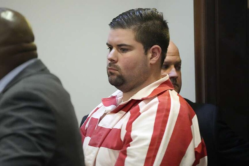 Daniel Opdyke, a former Rankin County Sheriff's Deputy and one of six former Mississippi law enforcement officers who pleaded guilty to a long list of state and federal charges enters the Rankin County Circuit Court for the state sentencing of his involvement in the 2023 racially motivated torture of two Black men, Wednesday, April 10, 2024, in Brandon, Miss. Time served for the state convictions will run concurrently with the federal sentences, and the men will serve their time in federal penitentiaries. (AP Photo/Rogelio V. Solis)