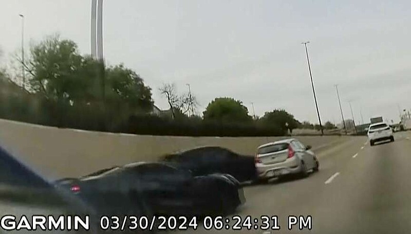In this screen grab taken from dash camera video provided by Bill Nabors, two speeding sports cars, left and second from left, cause a chain-reaction crash on the North Central Expressway, in Dallas, Saturday, March 30, 2024. Dallas police said Wednesday, April 10, that Kansas City Chiefs' wide receiver Rashee Rice faces charges including aggravated assault after he and another speeding driver of a sports car caused a chain-reaction crash on a Dallas highway.  (Bill Nabors via AP)
