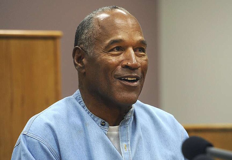FILE - Former NFL football star O.J. Simpson appears via video for his parole hearing at the Lovelock Correctional Center in Lovelock, Nev., on July 20, 2017. Simpson, the decorated football superstar and Hollywood actor who was acquitted of charges he killed his former wife and her friend but later found liable in a separate civil trial, has died. He was 76. (Jason Bean/The Reno Gazette-Journal via AP, Pool, File)
