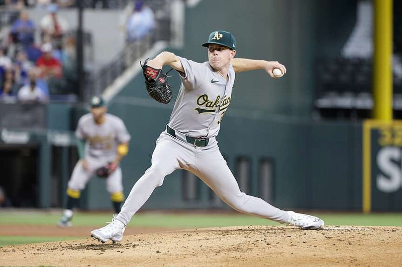 Oakland Athletics pitcher JP Sears throws against the Texas Rangers during the second inning of a baseball game Thursday, April 11, 2024, in Arlington, Texas. (AP Photo/Michael Ainsworth)