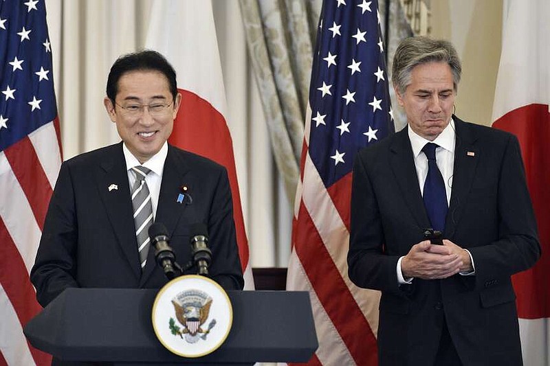 Secretary of State Antony Blinken, right, listens as Japanese Prime Minister Fumio Kishida speaks before a luncheon at the State Department in Washington, Thursday, April 11, 2024. (AP Photo/Cliff Owen)
