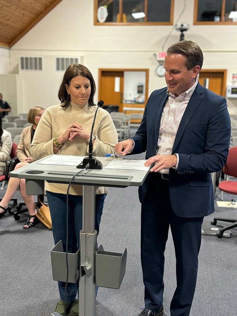 Courtesy/Jefferson City School District
Lindsey Rowden and new board member Ken Hussey take the oath of office Thursday at the regular April board meeting for the Jefferson City School District Board of Education.