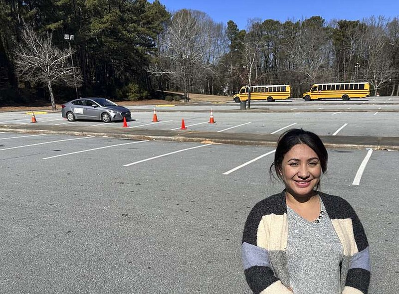 Nancy Gobran, instructor and owner of Safety Driving School, poses in an empty parking lot where she holds her driving lessons on Feb. 6, 2024 in Stone Mountain, Georgia. (AP Photo/Sharon Johnson)
