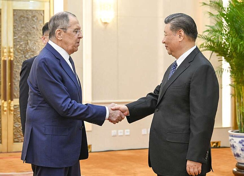 In this photo released by Xinhua News Agency, Russian Foreign Minister Sergey Lavrov, left, and Chinese President Xi Jinping meets at the Great Hall of the People in Beijing on April 9, 2024. China has surged sales to Russia of machine tools, microelectronics and other technology that Moscow in turn is using to produce missiles, tanks, aircraft and other weaponry. That's according to two senior Biden administration officials who discussed the sensitive findings on the condition of anonymity. Russia's microelectronics came from China, which Russia has used missiles, tanks and aircraft. (Li Xueren/Xinhua via AP)