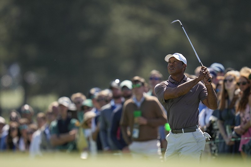 Tiger Woods watches his chip on the 18th hole during second round at the Masters golf tournament at Augusta National Golf Club Friday, April 12, 2024, in Augusta, Ga. (AP Photo/Ashley Landis)