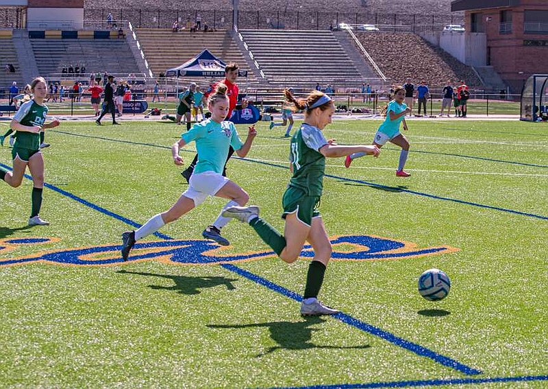 Ken Barnes/News Tribune
KC Athletics (in teal jerseys) takes on KC Scott Gallagher in a Presidents Cup U13 girls semifinal game Saturday at Helias Catholic High School.