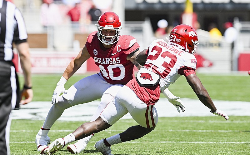 Arkansas defensive lineman Landon Jackson (40) of Texarkana, Texas, covers Arkansas running back Isaiah Augustave (23), Saturday, April 13, 2024, during the first quarter of the the Red-White Spring game at Reynolds Razorback Stadium in Fayetteville. (Photo by Charlie Kaijo/NWA Democrat-Gazette)