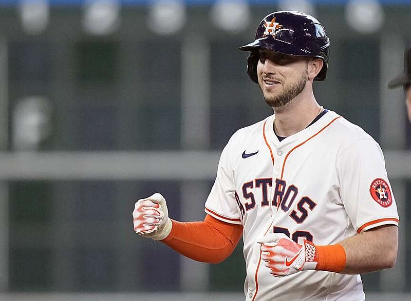 Houston Astros' Kyle Tucker celebrates after tying a baseball game with an RBI double during the fourth inning against the Texas Rangers, Saturday, April 13, 2024, in Houston. (AP Photo/Kevin M. Cox)