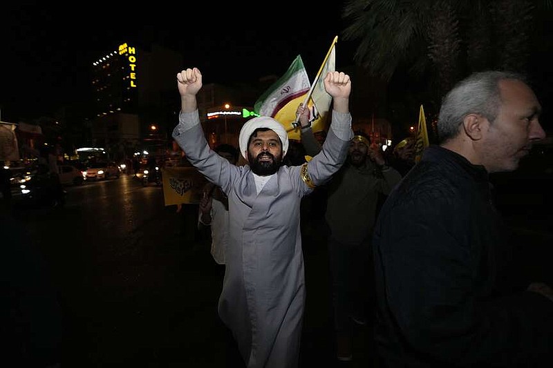 An Iranian cleric chants slogans while attending an anti-Israeli gathering at the Felestin (Palestine) Square in Tehran, Iran, early Sunday, April 14, 2024. Iran launched its first direct military attack against Israel Saturday. The Israeli military says Iran fired more than 100 bomb-carrying drones toward Israel. Hours later, Iran announced it had also launched much more destructive ballistic missiles. (AP Photo/Vahid Salemi)