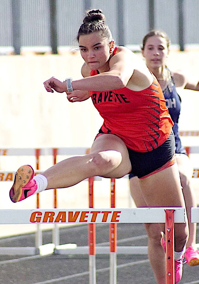 Randy Moll/Westside Eagle Observer
Gravette Senior Balen Nelson clears a hurdle on the way to a win in the 100-meter hurdles at the Gravette Lions Invitational track meet on Thursday.