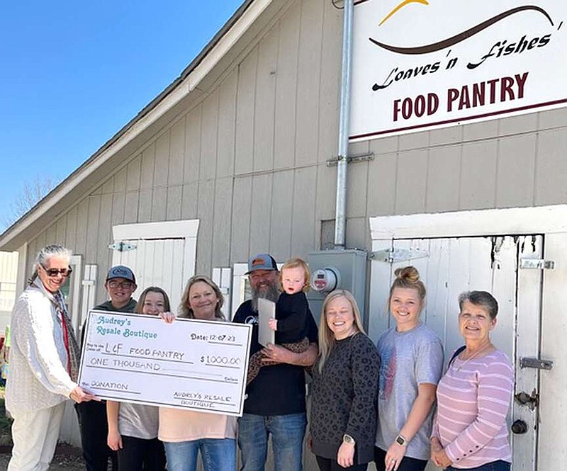 Courtesy photograph
Board members from Audrey's Resale Boutique recently donated $1,000 to Loaves 'n Fishes Food Pantry in Pea Ridge. Presenting and accepting the check were, from left: Kim Smith, Audrey's Board Member; Jason Harvey; Rhiannon Harvey; Jennifer Harvey, director of Loaves 'n Fishes; Jimmy Harvey holding granddaughter, Pierson; Abby Harvey; Hanna Harvey; and Peggy Siefert, Audrey's board member.