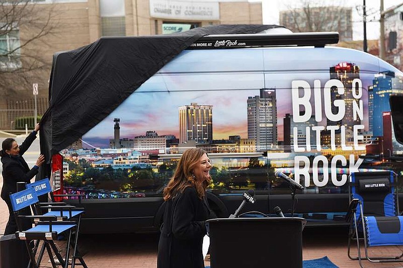 Gina Gemberling, president and CEO of the Little Rock Convention and Visitors Bureau, reacts to the unveiling of the bureau's new mobile visitors center Feb. 29 at the Statehouse Convention Center Plaza in downtown Little Rock. (Arkansas Democrat-Gazette/Staci Vandagriff)