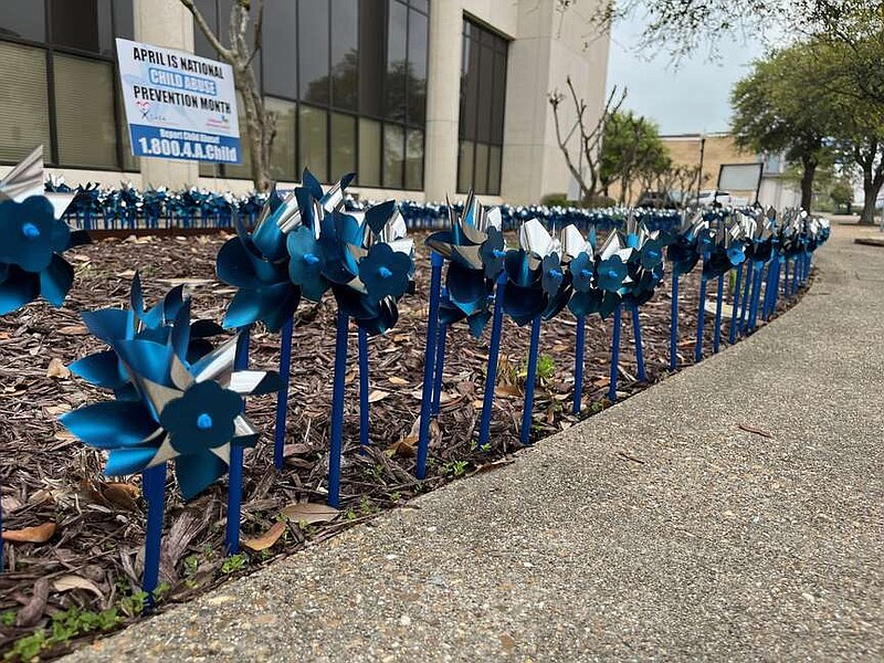 More than 1,700 pinwheels were placed in front of the Bi-State Justice Center on April 1, 2024, in an effort to raise awareness of Child Abuse Prevention Month. The pinwheels were placed by volunteers with CASA of North East Texas and the Texarkana Children's Advocacy Center. (Staff file photo by James Bright)