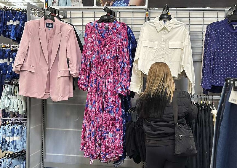 A shopper looks at clothes at a Walmart store in Secaucus, N.J., on March 25, 2024. On Monday, April 15, 2024, the Commerce Department releases U.S. retail sales data for March (AP Photo/Anne D'Innocenzio)