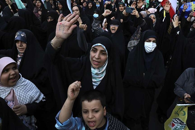 Iranian demonstrators chant slogans during a anti-Israeli gathering at the Felestin (Palestine) Sq. in Tehran, Iran, Monday, April 15, 2024. World leaders are urging Israel not to retaliate after Iran launched an attack involving hundreds of drones, ballistic missiles and cruise missiles. (AP Photo/Vahid Salemi)
