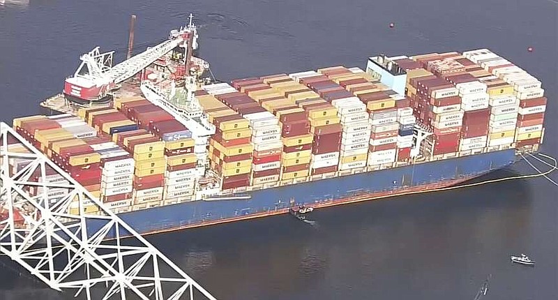 FBI agents get on board the cargo ship Dali on Monday, April 15, 2024 in Baltimore. The FBI is conducting a criminal investigation into the deadly collapse of the Francis Scott Key Bridge that is focused on the circumstances leading up to it and whether all federal laws were followed, according to someone familiar with the matter. (WJLA via AP)