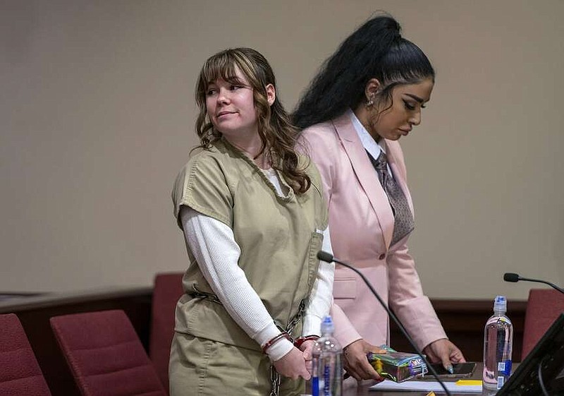 Hannah Gutierrez Reed, left, and paralegal Carmella Sisneros await sentencing in state district court in Santa Fe, New Mexico, on Monday April 15, 2024. Reed, the armorer on the set of the Western film "Rust," was sentenced to 18 months in prison for involuntary manslaughter in the death of cinematographer Halyna Hutchins, who was fatally shot by Alec Baldwin in 2021. (Eddie Moore/The Albuquerque Journal via AP, Pool)