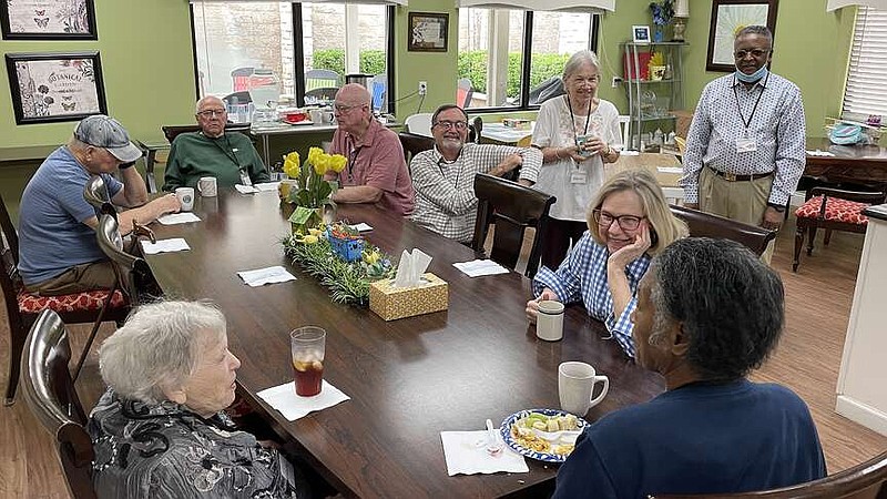 Guests at Our Place Day Respite Center talk to one another as they wait for breakfast Tuesday, April 16, 2024, in Texarkana, Texas. Alzheimer's Alliance Tri-State Area operates Our Place, where on Tuesdays, Wednesdays and Fridays, staff and volunteers care for people with Alzheimer's disease and other forms of dementia. The ninth annual Twice As Fine Texarkana Wine Festival, scheduled for Saturday, May 4, 2024, will benefit Alzheimer's Alliance. (Staff photo by Karl Richter)