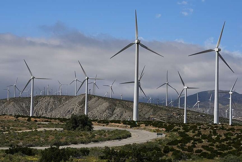 FILE - Wind turbines operate on March 7, 2024, in Palm Springs, Calif.    According to a new report published Tuesday, April 16, 2024, last year, marked the best year for new wind projects. (AP Photo/Ashley Landis, File)