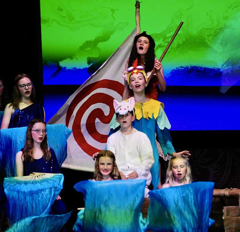 Joe Gamm/News Tribune photo:
From top down, Moana, played by Caroline Roepe; Hei Hei, played by Ava Lester; and Pua, played by Tate Allen, make their first attempt to cross out of the reef during rehearsal for Moana JR. at St. Joseph Cathedral School in Jefferson City.