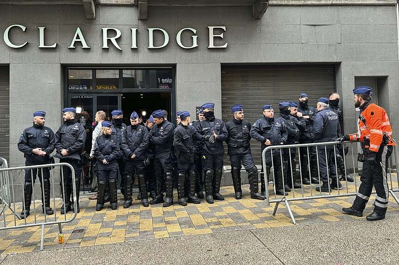 Police stand guard outside the front entrance of the event venue as the National Conservatism conference takes place in Brussels, Tuesday, April 16, 2024. (AP Photo/Sylvain Plazy)