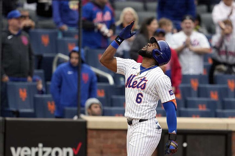 New York Mets' Starling Marte reacts as he reaches home plate after hitting a two-run home run during the third inning of a baseball game against the Pittsburgh Pirates, Wednesday, April 17, 2024, in New York. (AP Photo/Mary Altaffer)