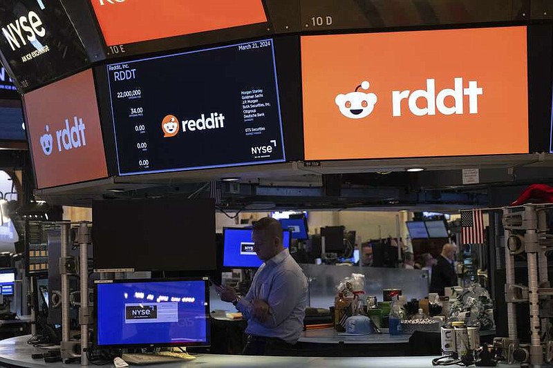 Reddit Inc. signage is seen on the New York Stock Exchange trading floor, prior to Reddit IPO, Thursday, March. 21, 2024. The market debut is likely to spur a flurry of commentary on Reddit's own platform, as well as competing social media outlets.  (AP Photo/Yuki Iwamura)