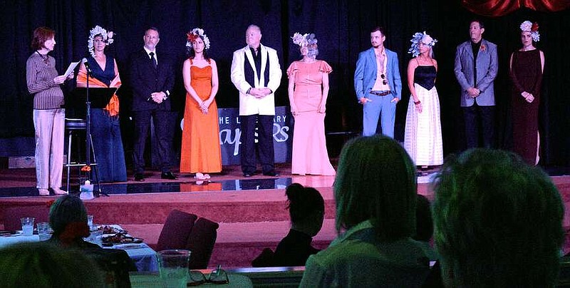 Participants in the Arkansas Single Parent Scholarship Fund spring style show stand on stage, Thursday, at the Vapors Live. (The Sentinel-Record/Donald Cross)