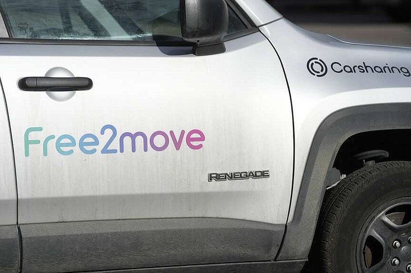A Free2move car sharing Jeep Renegade sits in a curbside spot Wednesday, April 12, 2023, in downtown Denver. (AP Photo/David Zalubowski)