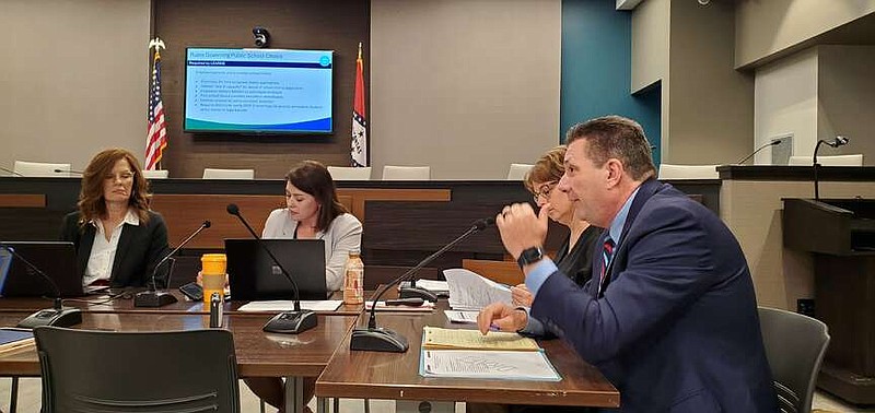 FILE - Arkansas Board of Education member Lisa Hunter considers draft rules for expanding parent choices for schools Wednesday March 6, 2024. Department of Education leaders, from left, Courtney Salas- Ford, Stacy Smith and Darrell Smith described the changes for the board. (Arkansas Democrat-Gazette/Cynthia Howell).