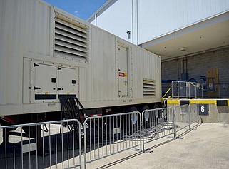 A generator sits at the rear of the Hot Springs Convention Center, where it has been providing power for the four exhibit halls for nearly a month. (The Sentinel-Record/Donald Cross)