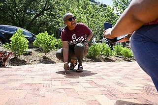 Melanie Bynum Jackson finds her name on an alumni brick outside the Bailey Alumni Center during an opening ceremony of the new alumni patio plaza on the UALR campus on Friday, May 10, 2024

(Arkansas Democrat-Gazette/Stephen Swofford)