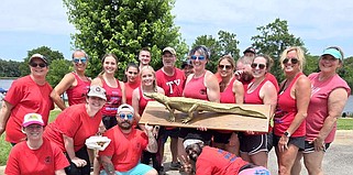 In Deep Ship pose with the Golden Gator Award after winning the mixed division at the seventh annual Dragon Boat Festival race Saturday, May 11, 2024, at Bringle Lake Park in Texarkana, Texas. (Photo courtesy HandsOn Texarkana)