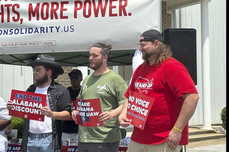 Mercedes employees Austin Brooks, David Johnston and Jacob Ryan attend a rally in Tuscaloosa, Ala., May 5, 2024.  A month after workers at a Volkswagen factory in Tennessee overwhelmingly voted to unionize, the United Auto Workers is aiming for a key victory at Mercedes-Benz in Alabama.  More than 5,000 workers at the facility in Vance and nearby battery plant will vote next week on whether to join the UAW. (AP Photo/Kim Chandler)