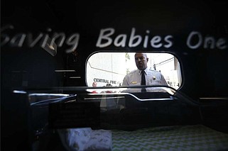 Little Rock assistant fire chief Michael Doan gives a demonstration of how the safe baby box works during a dedication ceremony on Wednesday, May 15, 2024, at the Little Rock Central Fire Station.
(Arkansas Democrat-Gazette/Thomas Metthe)