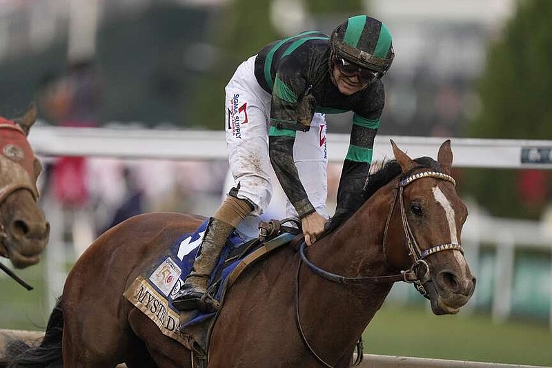 Brian Hernandez Jr. celebrates after riding Mystik Dan to win the 150th running of the Kentucky Derby horse race at Churchill Downs Saturday, May 4, 2024, in Louisville, Ky. (AP Photo/Brynn Anderson)