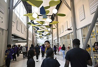 People explore the halls of the new  the new Dr. Marian G. Lacey K-8 Academy in Little Rock after a ribbon cutting ceremony on Thursday, May 16, 2024.

(Arkansas Democrat-Gazette/Stephen Swofford)