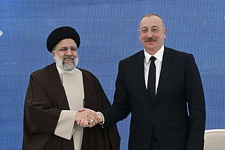 In this photo provided by the Azerbaijan's Presidential Press Office, Iranian President Ebrahim Raisi, left, shakes hands with his Azeri counterpart Ilham Aliyev during their meeting in the inauguration ceremony of dam of Qiz Qalasi, or Castel of Girl in Azeri, at the border of Iran and Azerbaijan, Sunday, May 19, 2024. A helicopter carrying Iranian President Ebrahim Raisi suffered a "hard landing" on Sunday, Iranian state media reported, without immediately elaborating. (Azerbaijani Presidential Press Office via AP)