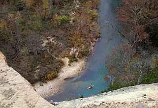 FILE - A kayak paddler on the Buffalo National River is seen from the Goat Trail. The foot path lies 300 feet above the Buffalo River. (Northwest Arkansas Democrat-Gazette/FLIP PUTTHOFF)