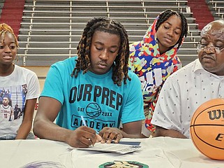 Pine Bluff senior Randy Emerson Jr. signs with OUR Prep Academy during Thursday's event in the McFadden Gym. (Pine Bluff Commercial/Tanner Spearman)