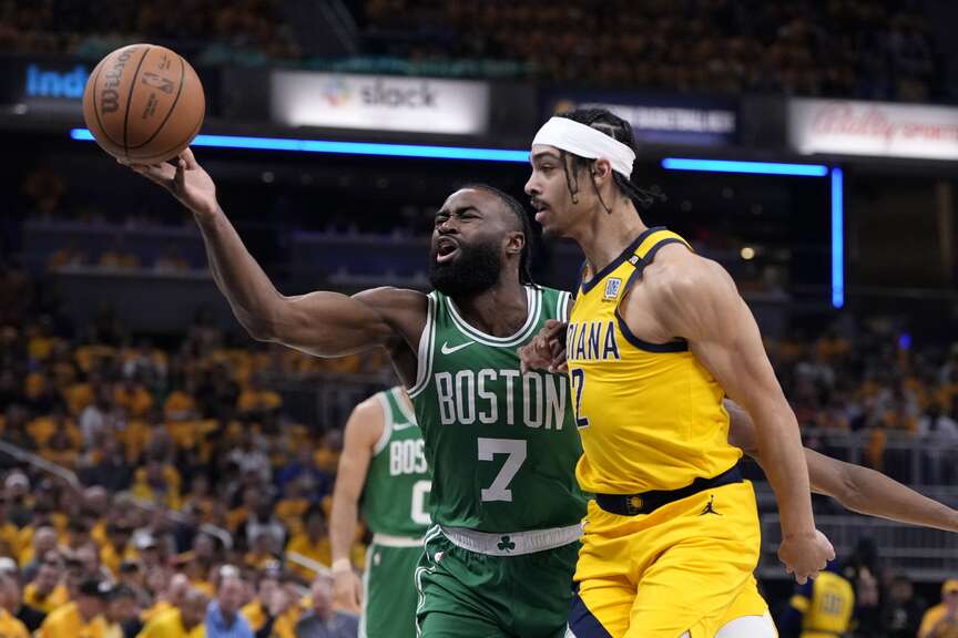  Boston Celtics guard Jaylen Brown (7) drives to the basket in front of Indiana Pacers guard Andrew Nembhard (2) during the first half of Game 4 of the NBA Eastern Conference basketball finals, Monday, May 27, 2024, in Indianapolis. (AP Photo/Michael Conroy)
