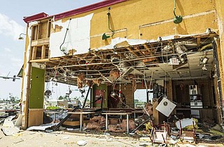 Storm damage is shown, Sunday, May 26, 2024 at Popeyes  at the shopping center on West Walnut Ave and North 24th St. in Rogers. (NWA Democrat-Gazette/Charlie Kaijo)
