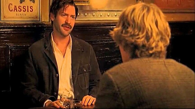 Earnest Hemingway (Corey Stoll) gives time-traveling screenwriter Gil Pender (Owen Wilson) some writing tips in Woddy Allen's “Midnight in Paris.”