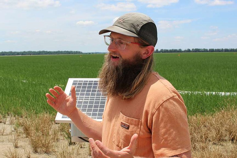 Geoffrey Payne, agricultural research technician with the Delta Water Management Research Center in Jonesboro, spoke about smart irrigation systems being developed for rice production at a tour of Scott Matthews' Farm in Weiner, AR on Tuesday, June 11, 2024. The tour was part of The Conservation Technology Information Center's Conservation in Action Tour.