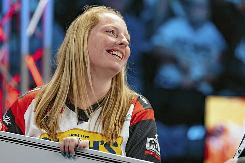 This Aug. 3, 2023, photo provided by the American Cornhole League shows Cheyenne Bubenhein celebrating her win in the ACL Pro Shootout Championship in Rock Hill, S.C. The recreational game of cornhole wouldn't seem to have any characteristics that would give men an inherent advantage over women. Yet no woman ever has won a championship in the nine-year-old American Cornhole League's gender-neutral pro singles division. Cheyenne Bubenheim wants to change that. (Haleigh Shedd/American Cornhole League via AP)